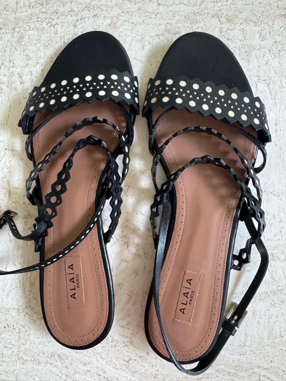Alaïa Black Laser-Cut Lace-Up Sandals with Cream Accents